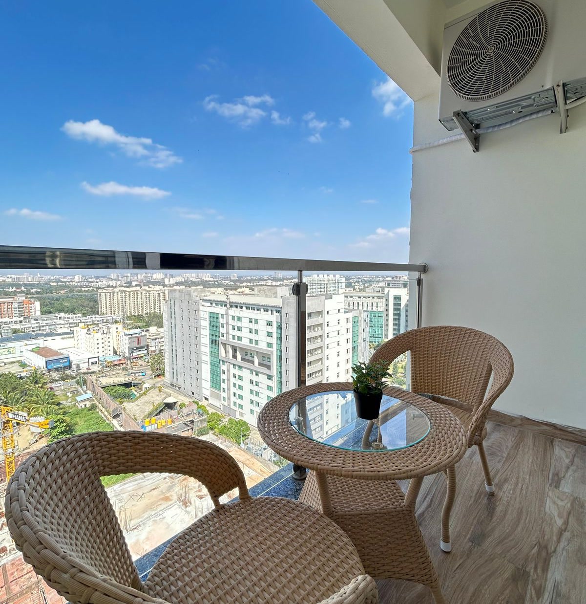 Balcony with city views and rattan seating